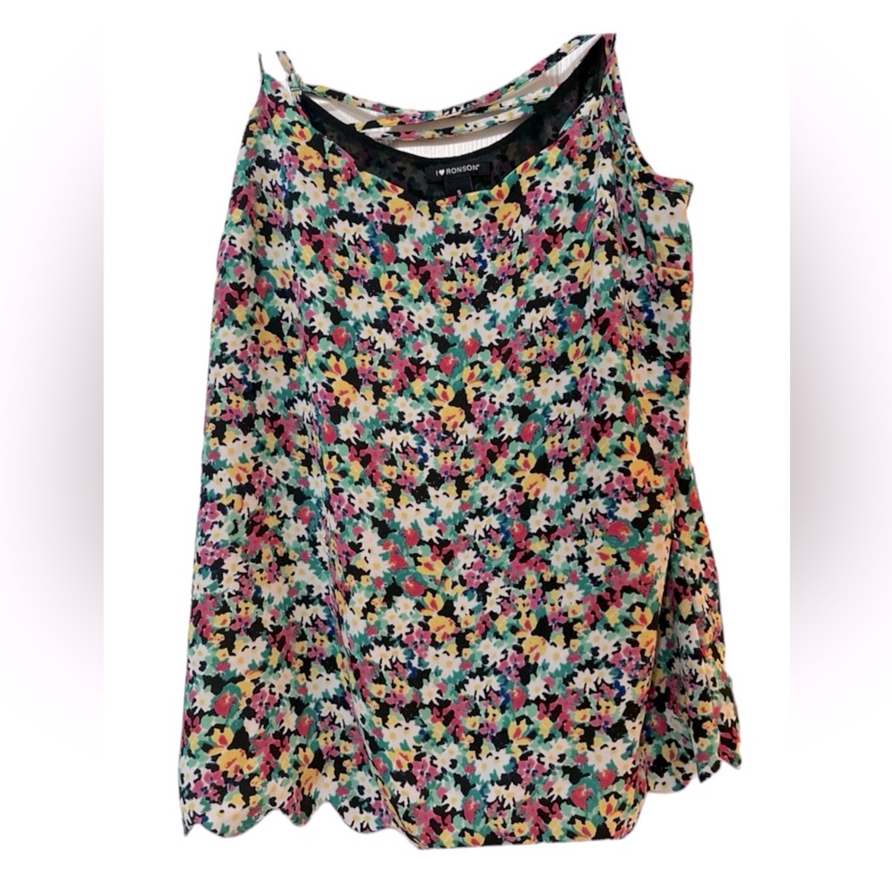 Floral tank, criss-cross back, scalloped hem at bottom in size Small.